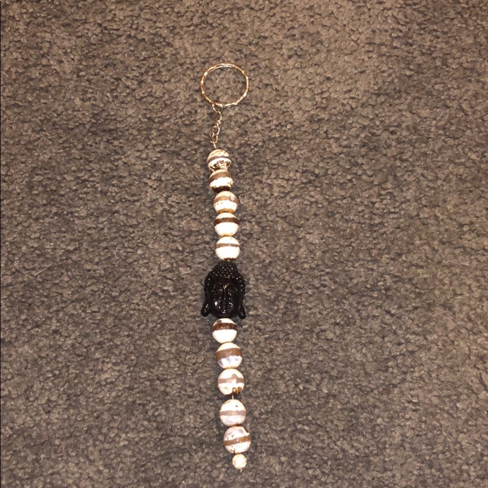 Super cute keychain with black Buddha in middle